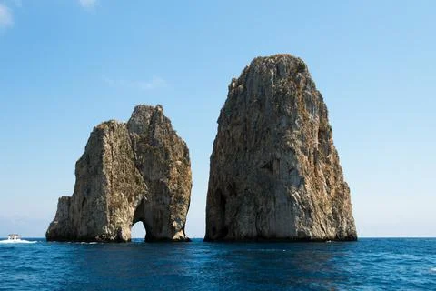 Cliffs and stone formations in the middle of the sea in capri italy Foto stock