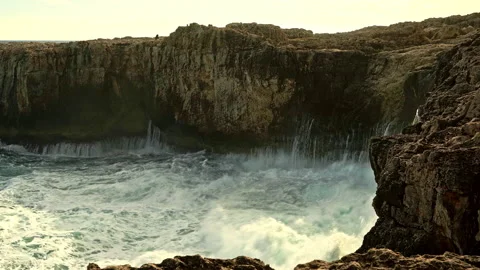 The cliffs and the stormy waves of the sea at the Plemmirio Nature Reserve Video stock 233477867