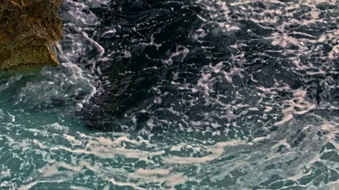 The cliffs and the stormy waves of the sea at the Plemmirio Nature Reserve Stock Footage 233477886