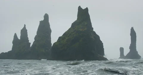 The cliffs and waves at the black sand beach, Reynisfjara in Vik, Iceland Stock Footage 145690423