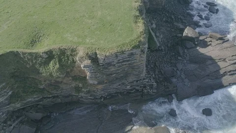 Cliffs and waves drone view in Santander, Spain Stock Footage 111979758