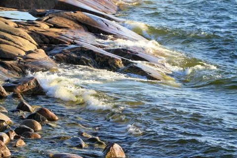 Cliffs and waves Stock Photos