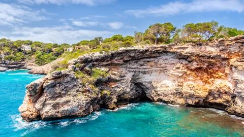 Cliffs around beach, Cala Llombards in Mallorca, Balearic Island, Spain Stock Photos