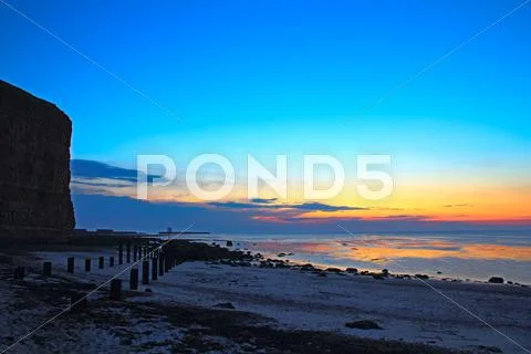 Cliffs, beach and sunset 2350 Stock Photos