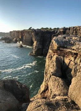 Cliffs of Boca do Inferno in Cascais, Portugal at sunset Stock Photos