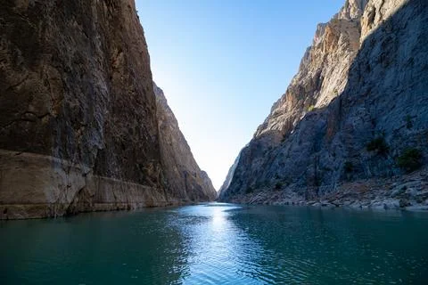 Cliffs of the canyon and river at sunset Stock Photos