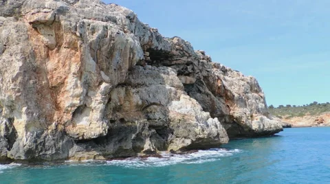Cliffs With Caves Seen From The Sea Stock Footage 49882234