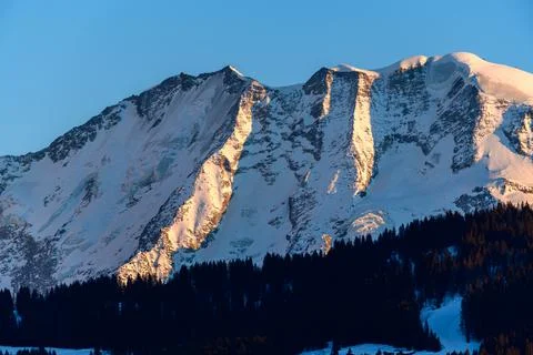 The cliffs of Domes de Miage lit by the Sun in Europe, France, Rhone Alpes, S Stock Photos