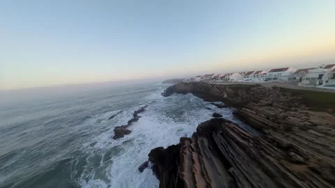 Cliffs edge meets ocean at dusk; Baleal Video stock 346074400