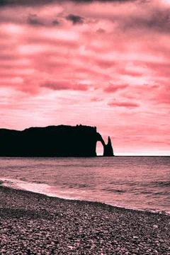 Cliffs of etretat on pink background Stock Photos