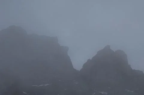 Cliffs in the fog. Stock Photos