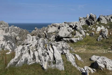 The Cliffs of Hell with beautiful rock formations and coves in Ribadesella .. Stock Photos