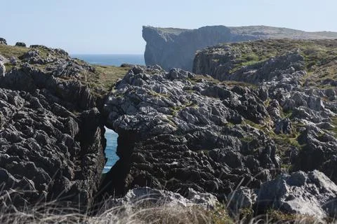 The Cliffs of Hell with beautiful rock formations and coves in Ribadesella .. Photos