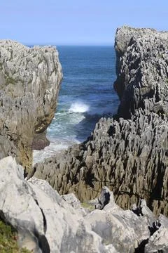 The Cliffs of Hell with beautiful rock formations and coves in Ribadesella .. Stock Photos