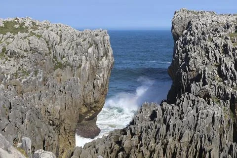 The Cliffs of Hell with beautiful rock formations and coves in Ribadesella .. Stock Photos