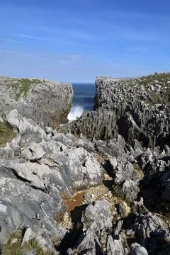 The Cliffs of Hell with beautiful rock formations and coves in Ribadesella .. Stock Photos