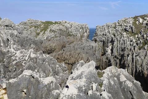 The Cliffs of Hell with beautiful rock formations and coves in Ribadesella .. Photos