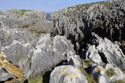 The Cliffs of Hell with beautiful rock formations and coves in Ribadesella .. Photos