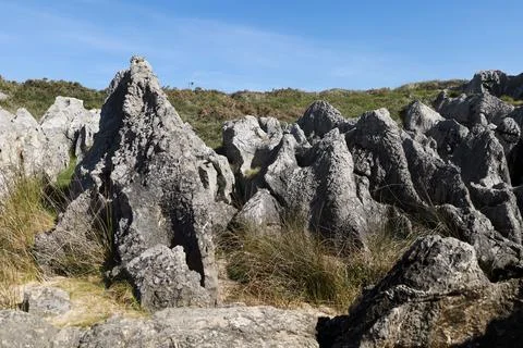 The Cliffs of Hell with beautiful rock formations and coves in Ribadesella .. Stock Photos