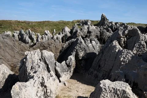 The Cliffs of Hell with beautiful rock formations and coves in Ribadesella .. Stock Photos