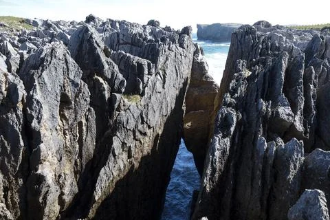 The Cliffs of Hell with beautiful rock formations and coves in Ribadesella .. Photos