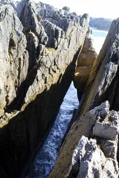The Cliffs of Hell with beautiful rock formations and coves in Ribadesella .. Stock Photos
