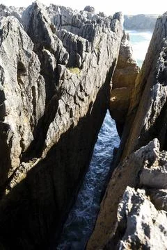 The Cliffs of Hell with beautiful rock formations and coves in Ribadesella .. Photos