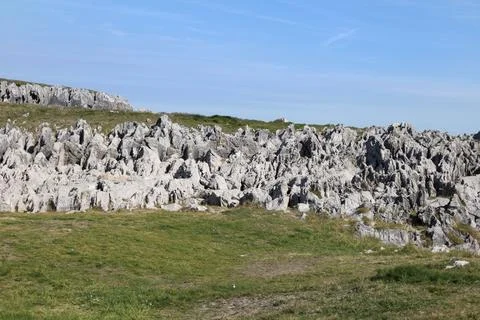 The Cliffs of Hell with beautiful rock formations and coves in Ribadesella .. Stock Photos