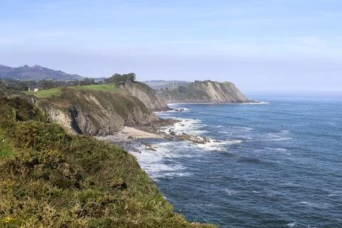 The Cliffs of Hell with beautiful rock formations and coves in Ribadesella .. Stock Photos