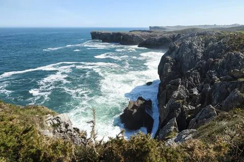 The Cliffs of Hell with beautiful rock formations and coves in Ribadesella .. Stock Photos