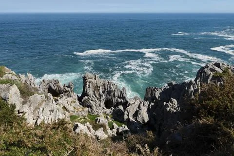 The Cliffs of Hell with beautiful rock formations and coves in Ribadesella .. Stock Photos