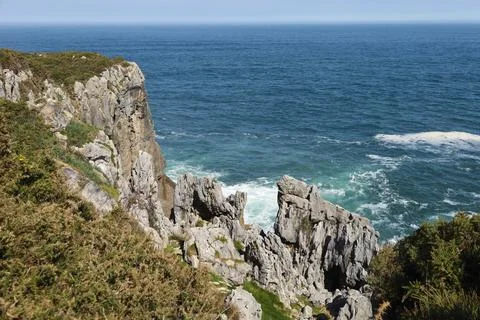 The Cliffs of Hell with beautiful rock formations and coves in Ribadesella .. Fotos Stock