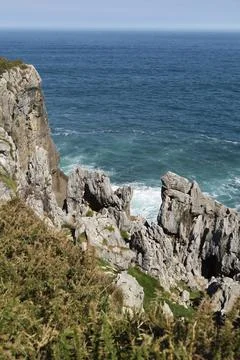 The Cliffs of Hell with beautiful rock formations and coves in Ribadesella .. Fotos Stock