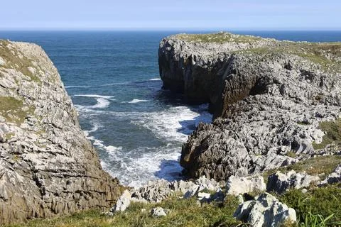 The Cliffs of Hell with beautiful rock formations and coves in Ribadesella .. Stock Photos