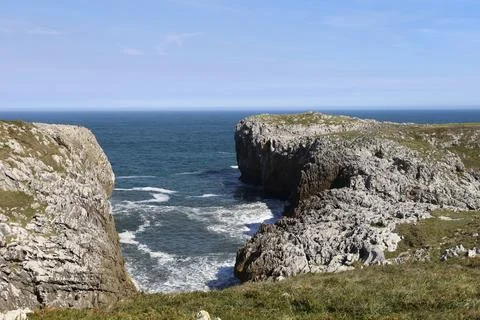 The Cliffs of Hell with beautiful rock formations and coves in Ribadesella .. Stock Photos