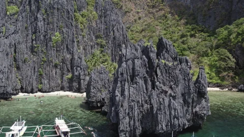 Cliffs in Lagoon on the islands, Palawan, boats Philippines. Drone view Stock Footage 271630880