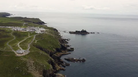 Cliffs off of Lands end with big waves and stunning scenery Cornwall UK Stock Footage 262656342