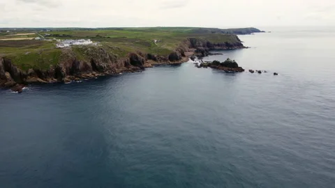 Cliffs off of Lands end with big waves and stunning scenery Cornwall UK Stock Footage 262656856