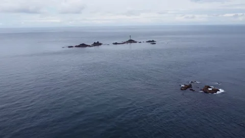 Cliffs off of Lands end with big waves and stunning scenery Cornwall UK Stock Footage 262656859