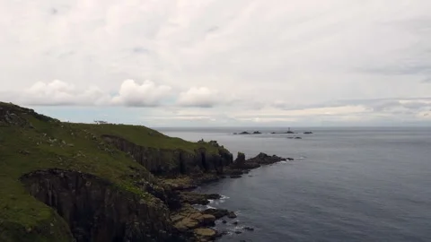 Cliffs off of Lands end with big waves and stunning scenery Cornwall UK Stock Footage 262657033