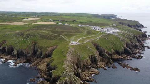 Cliffs off of Lands end with big waves and stunning scenery Cornwall UK Stock Footage 262675609