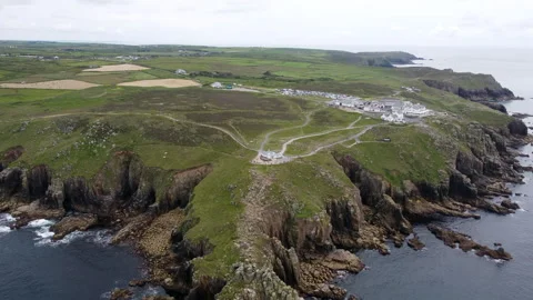 Cliffs off of Lands end with big waves and stunning scenery Cornwall UK Stock Footage 262675860
