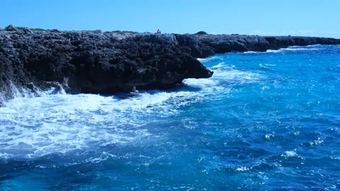 Cliffs of Menorca, Spain. Waves of blue sea hurl themselves on the rocks. Stock Footage 162764661