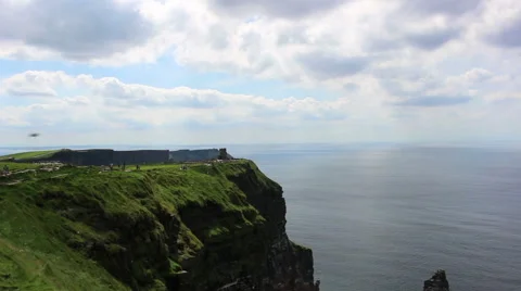 Cliffs of Moher in Ireland Cliffs into Ocean Water Blue Skies Stock Footage 67553391