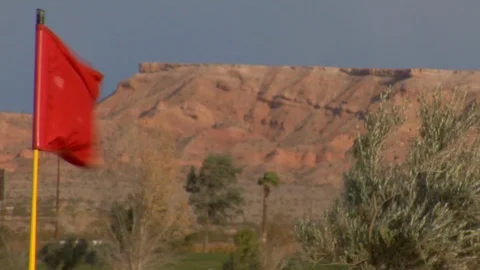 Cliffs mountains in desert behind putting green golf course Stock Footage 125343675