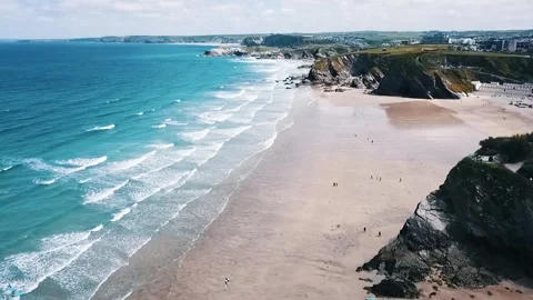 Cliffs At Newquay Beach Panning drone Shot to The Sea Stock Footage 299333697