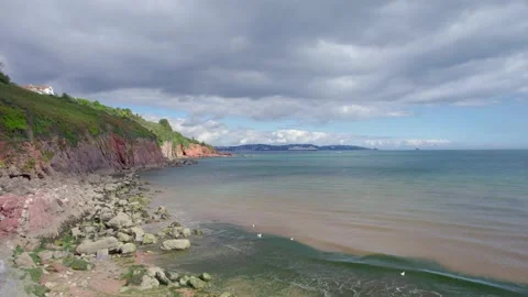 Cliffs over Broadsands Beach from a drone, Paignton, Devon, England, Europe Video stock 161075764