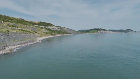 Cliffs over  Jurassic Coast from a drone, Jurassic Coast, Lyme Regis, Dorset, UK 動画素材 250411086