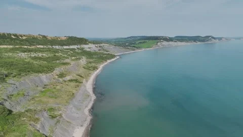 Cliffs over  Jurassic Coast from a drone, Jurassic Coast, Lyme Regis, Dorset, UK Stock Footage 250411105