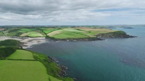 Cliffs over Mothecombe Beach and Red Cove, River Emme, Mothecombe, Devon, UK Stock Footage 280014696
